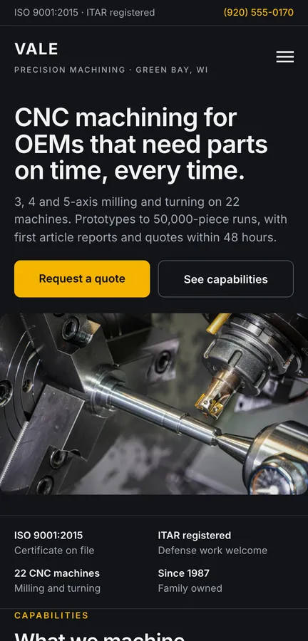 The redesigned Vale home page on a phone, dark with an amber accent, a headline about on-time CNC parts, quote and capabilities buttons, a trust strip and a capabilities grid.